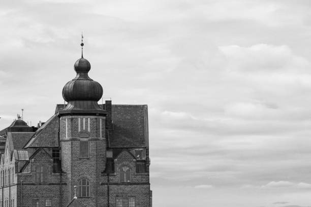 Low angle view of building against cloudy sky