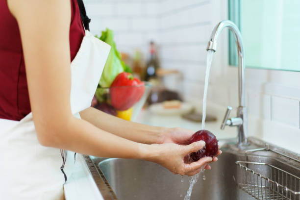 istock Woman cooking and working in kitchen. 1456489254
