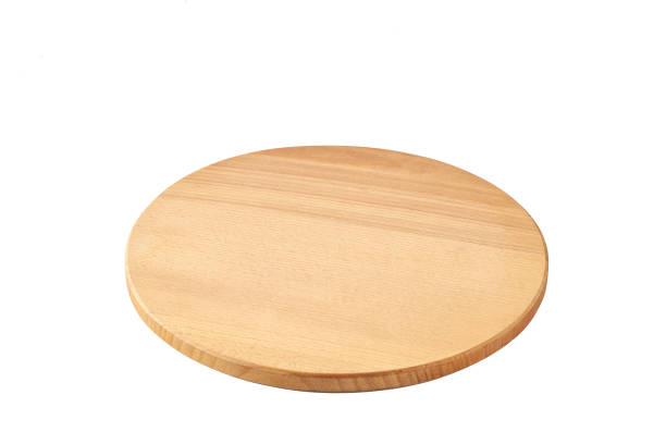 istock Empty round wooden pizza board isolated on white background. 1456491284