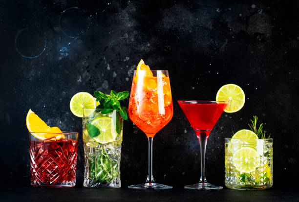 Most popular trendy cocktails set: Spritz, negroni, mojito, gin tonic and cosmopolitan on gray bar counter background stock photo