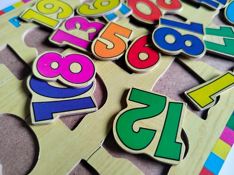 a photo of a puzzle toy in the shape of a number