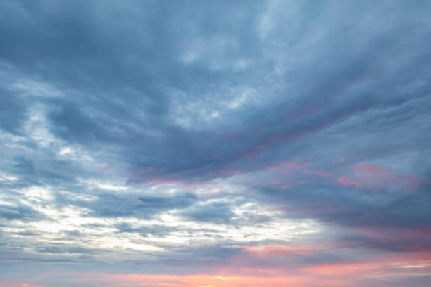 Colorful pastel sky with clouds at dawn as natural background stock photo