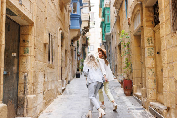 istock Happy travelers in old Mediterranean town 1456499377