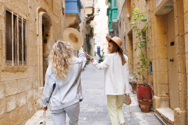 istock Happy travelers in old Mediterranean town 1456499587