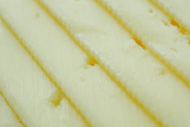 istock close up of fresh cheese on white background. 1456500486