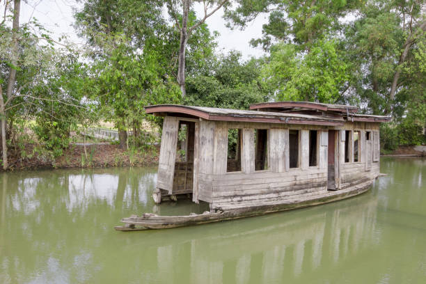 istock Old abandoned wooden boat in canal 1456503094