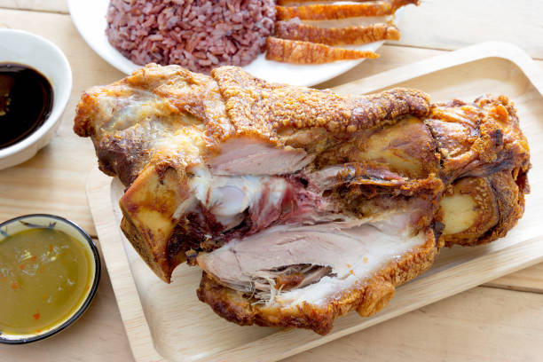 istock Closeup fried pork leg cooked with cooked jasmine rice 1456505346