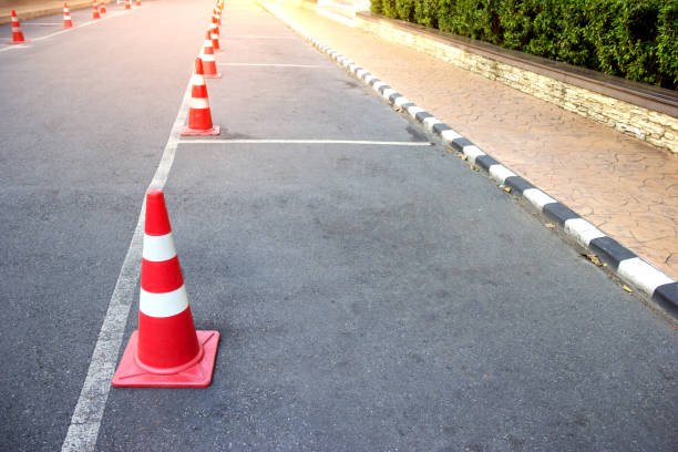 istock traffic cone with lines parking on asphalt 1456505519