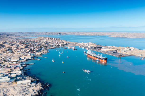 istock Freight vessel against backdrop of Luderitz, Namibia, wide 1456506349