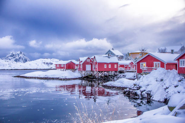 Snowing fishing town of Svolvaer in the Lofoten in Norway Snowing fishing town of Svolvaer in the Lofoten in Norway harbor of svolvaer in winter lofoten islands norway stock pictures, royalty-free photos & images