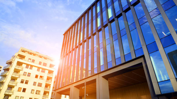 istock Glass modern building with blue sky background. Low angle view and architecture details. 1456512049