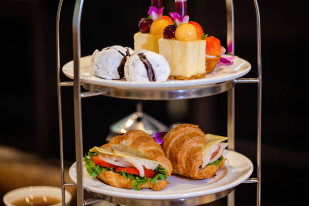 istock Traditional afternoon tea with fancy table set with sandwiches 1456512963