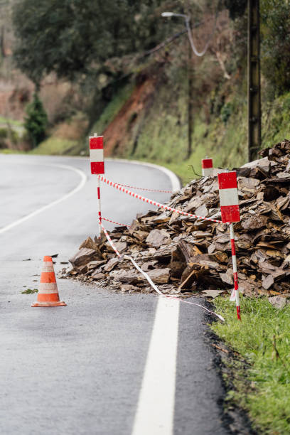istock Rocks blocking the road due to a rockslide after a heavy rainfall. 1456515486