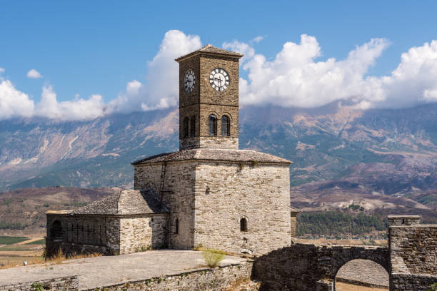 Clock Tower in Gjirokaster Citadel surrounded by ancient ruins, attraction in Albania Gjirokaster has a beautiful clock tower and fortress where Ottoman heritage is clearly visible gjirokaster castle albania stock pictures, royalty-free photos & images