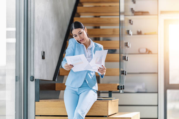 istock Young businesswoman using smart phone 1456527753