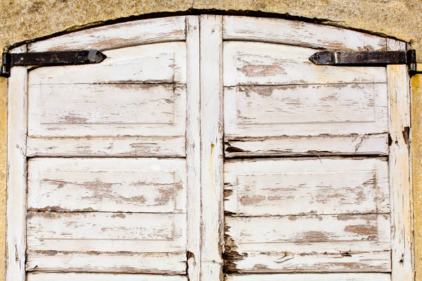 Old wooden white door, stone facade stock photo