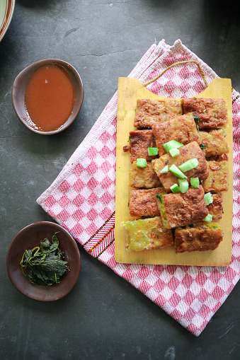 Martabak Telor or Murtabak Telur or mutabbaq. Savory pan-fried pastry stuffed with egg, meat and spices. Martabak Telur is one of Indonesia street food.