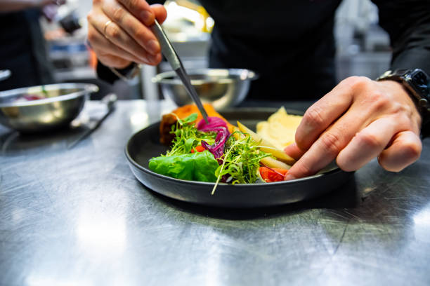 istock chef hand preparing Meat Pie with mashed potato and salad on restaurant kitchen 1456535103
