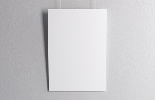 A4 format paper hanging infront of a white wall isolated with soft shadow