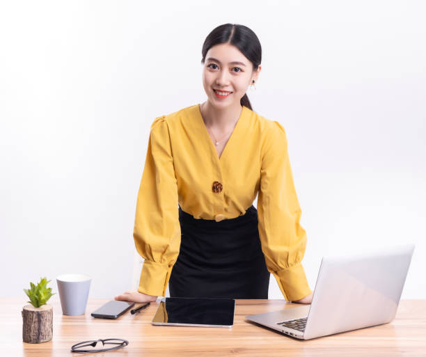 istock Business woman standing at their desks at work 1456536592