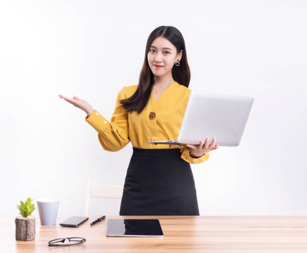 istock Business woman standing at their desks at work 1456536614