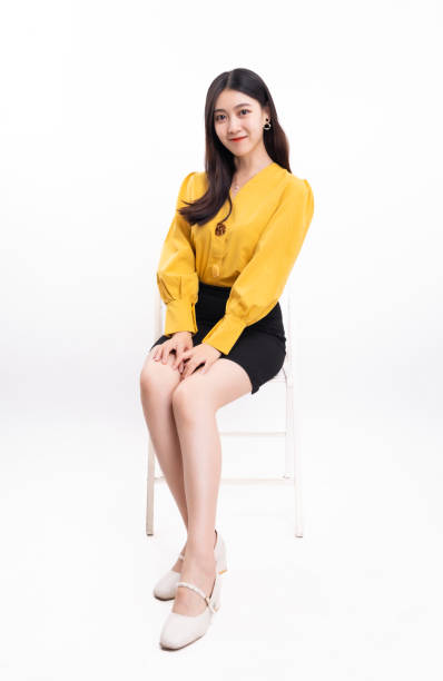 istock Business woman sitting on white background 1456536622