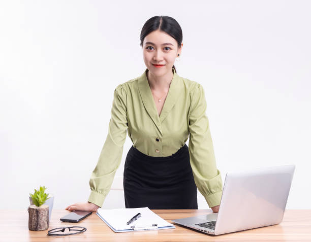 istock Business woman standing at their desks at work 1456536659