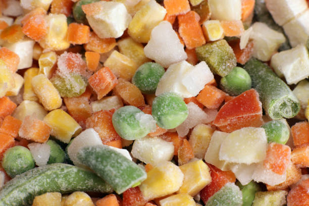 istock Mexican Mix of frozen vegetable containing carrots, peas, corn, background, texture 1456538841