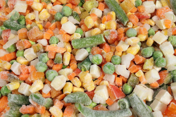istock Mexican Mix of frozen vegetable containing carrots, peas, corn, background, texture 1456538896