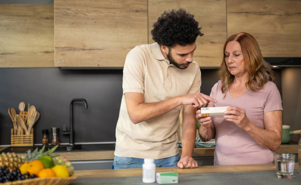 istock Healthcare Aide Explaining Medicine Dosage To Senior Patient 1456539492
