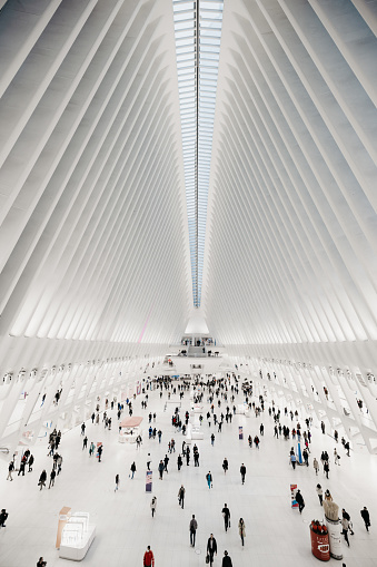 New York City, NY, United States - October 3rd, 2022: The Oculus - World Trade Center Transportation Hub and mall in New York. Interior wide angle view of the building, it connects subway and train systems in Lower Manhattan, New York. The Westfield World Trade Center has been opened to the public on August 16th 2016, it was built by the architect Santiago Calatrava.