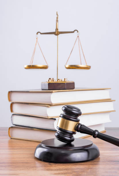istock The scales and the judge's hammer on the table 1456542310