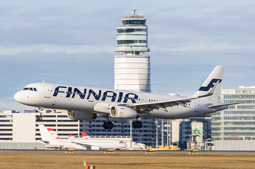 Vienna, Schwechat - January 07, 2023: An Airbus A321 of finnish airline Finnair landing in Vienna arriving from Helsinki