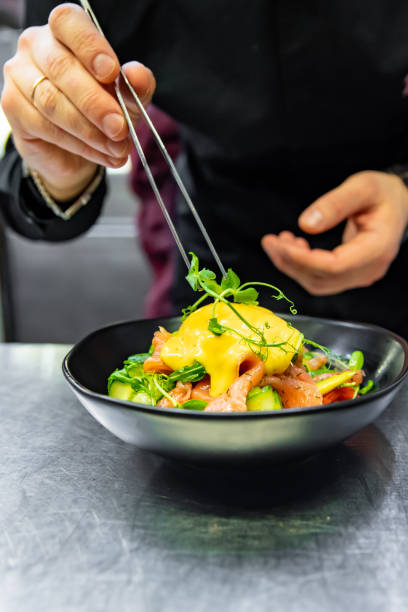 istock Chef in restaurant kitchen cooking salad 1456546306