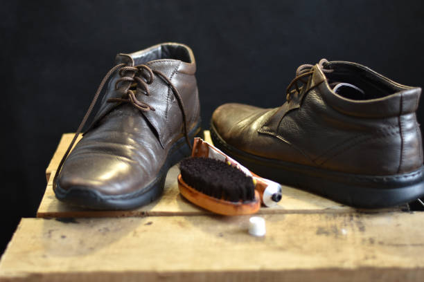 istock Shoes and a brush to clean them. 1456546438
