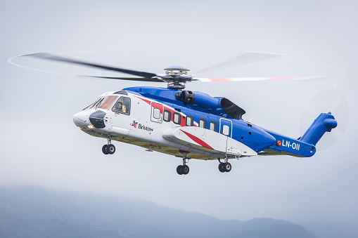 Bergen, Norway - June 13, 2022: A Bristow Helicopters Sikorsky S-61N on final to Bergen Airport coming from an oil rig