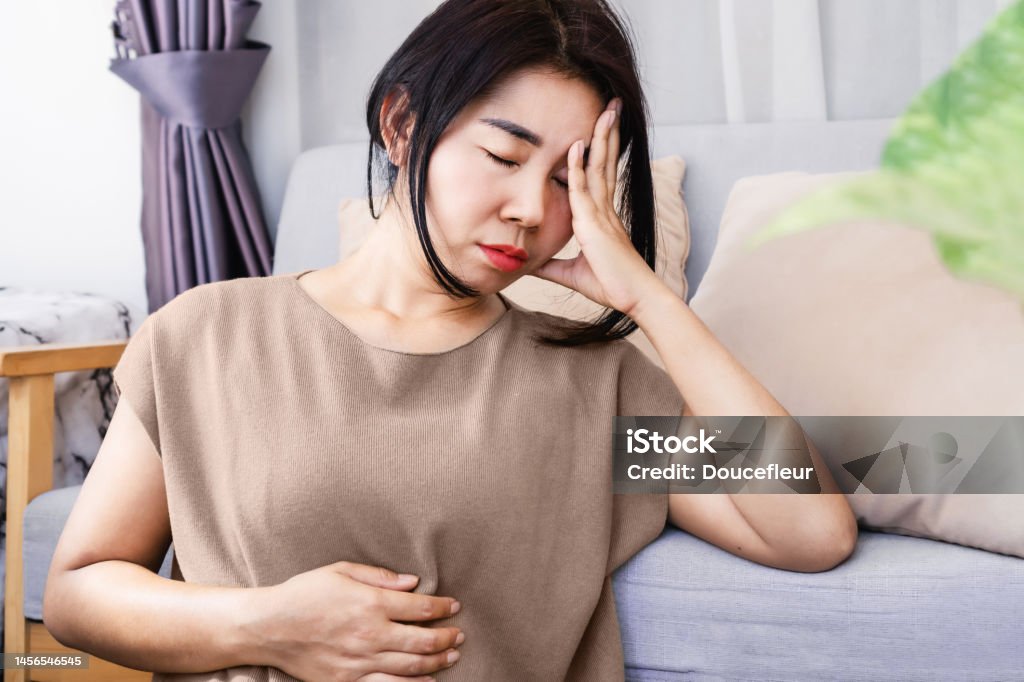 Gut-Brain Axis and anxiety concept,Asian women have problems with digestion systems, stomachache, irritable bowel syndrome ( IBS) Gut-Brain Axis and anxiety concept with stress Asian woman have problems with digestion systems, stomachache, irritable bowel syndrome ( IBS) Abdomen Stock Photo