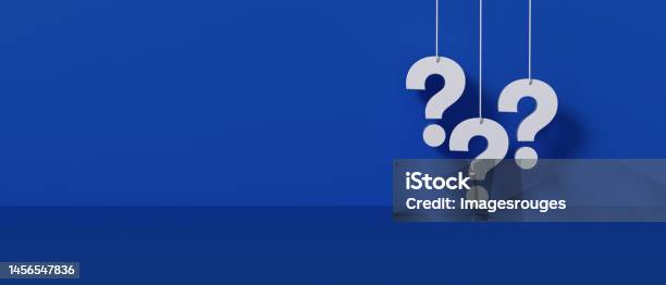 Three White Question Marks A Blue Wall Background Stock Photo - Download Image Now - Question Mark, Asking, Q and A