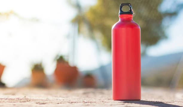 A red aluminum bottle over the floor