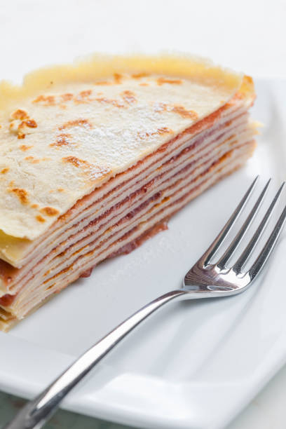 cake made of pancakes with strawberry jam