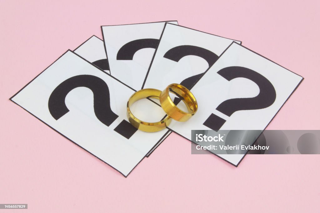 Ring Inverted Question Hallmark Wedding Rings And Question Marks On Pink Background Stock Photo ...