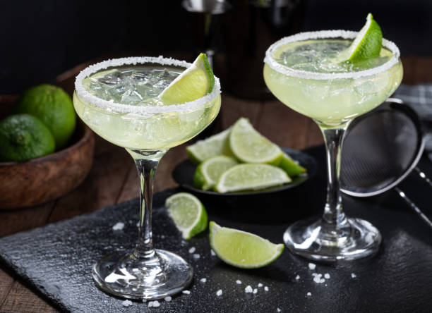 istock Margarita cocktail with ice, lime and salt rim 1456562604