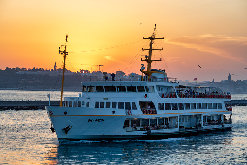 Istanbul, Turkey - Jun 13, 2019: Vapur is a kind of passenger ship widely used in Istanbul. In the photo, one vapur is leaving the port.