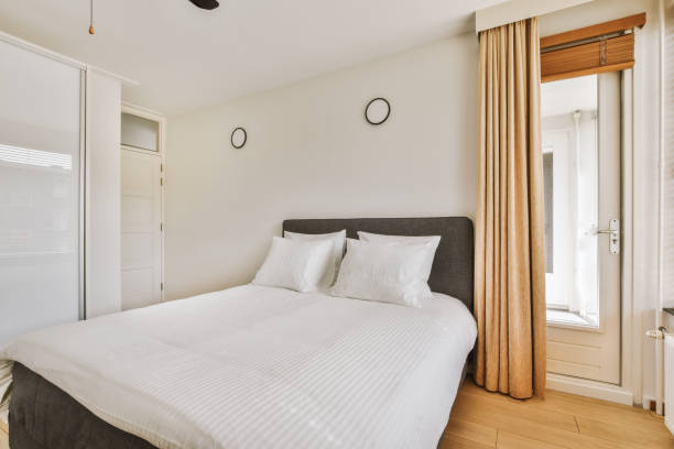 istock Light bedroom with wooden wardrobe 1456565374