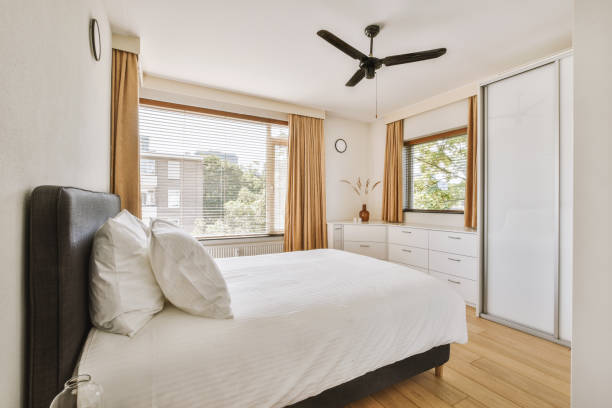 istock Light bedroom with wooden wardrobe 1456565578
