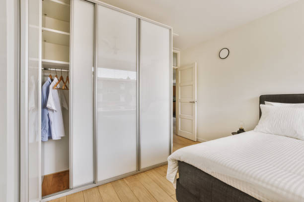 istock Light bedroom with wooden wardrobe 1456565878