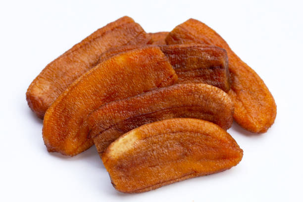 istock Sun dried bananas on white background. 1456568900