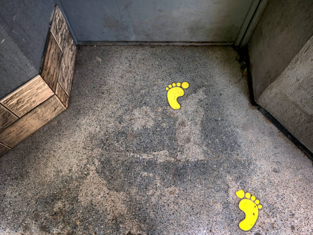 Yellow footprints stock photo