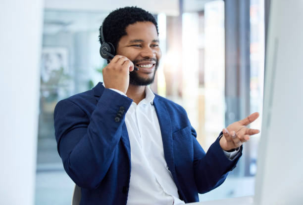 istock Call center, customer service and communication with a business black man talking using a headset in his office. Marketing, contact and networking with a male employee working in sales or retail 1456573663