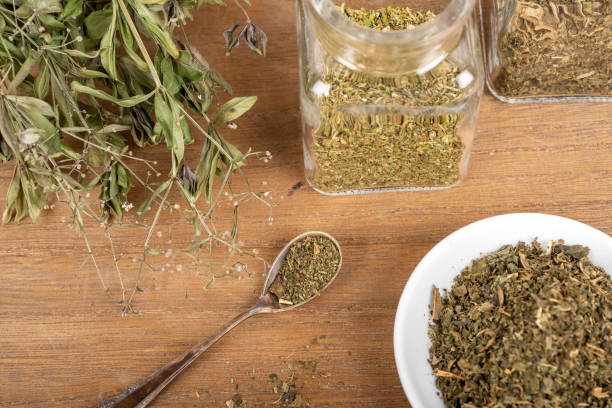 istock Herbal tea or dried herbs or medicine in jars with spoon 1456576577
